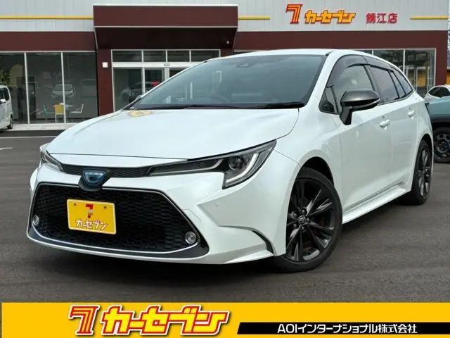 2021 Toyota Corolla Touring 1.8 Hybrid WxB - photo 1 2021 Toyota Corolla Touring 1.8 Hybrid WxB White Van for sale, Japanese used car export - photo 1 of 49 | GULJI TRADERS