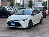 2021 Toyota Corolla Touring Hybrid WXB Pearl Van for sale, Japanese used car export - photo 1 of 29 | GULJI TRADERS