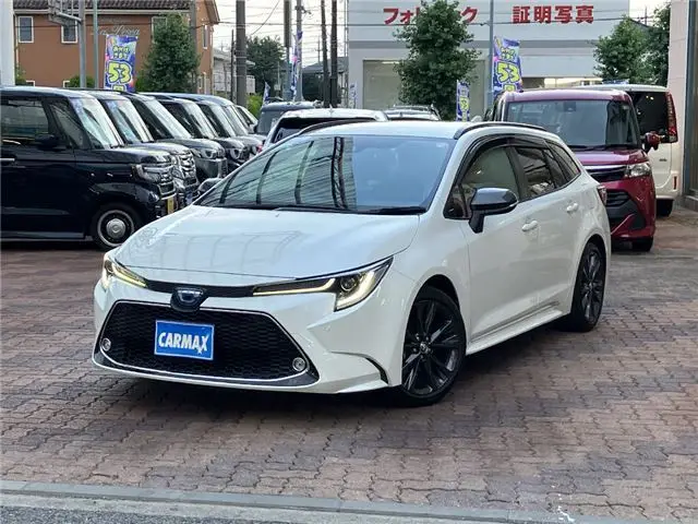 2021 Toyota Corolla Touring Hybrid WXB - photo 1 2021 Toyota Corolla Touring Hybrid WXB Pearl Van for sale, Japanese used car export - photo 1 of 29 | GULJI TRADERS