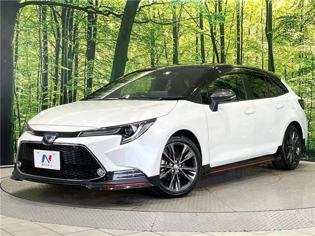 2021 Toyota Corolla Touring Hybrid Double By - photo 1 2021 Toyota Corolla Touring Hybrid Double By Pearl Van for sale, Japanese used car export - photo 1 of 30 | GULJI TRADERS