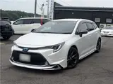 2021 Toyota Corolla Touring Hybrid Double WBY ★ Modellista Aero ★ Genuine Navigation System ★ Pearl Van for sale, Japanese used car export - photo 1 of 37 | GULJI TRADERS