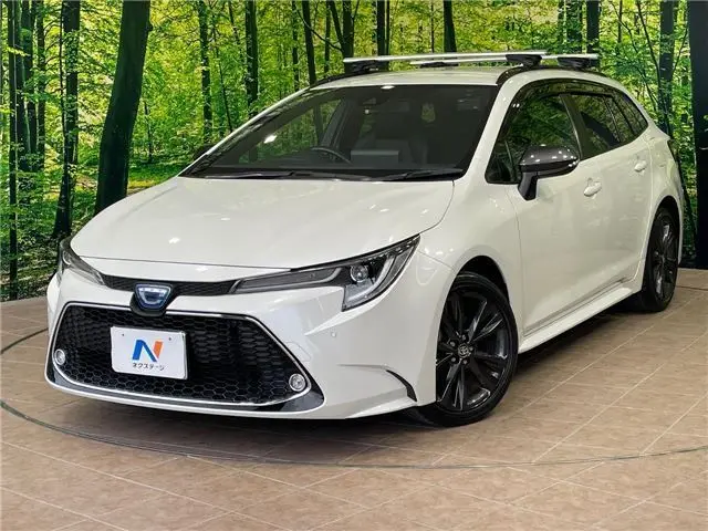2021 Toyota Corolla Touring Hybrid Double By - photo 1 2021 Toyota Corolla Touring Hybrid Double By Pearl Van for sale, Japanese used car export - photo 1 of 30 | GULJI TRADERS
