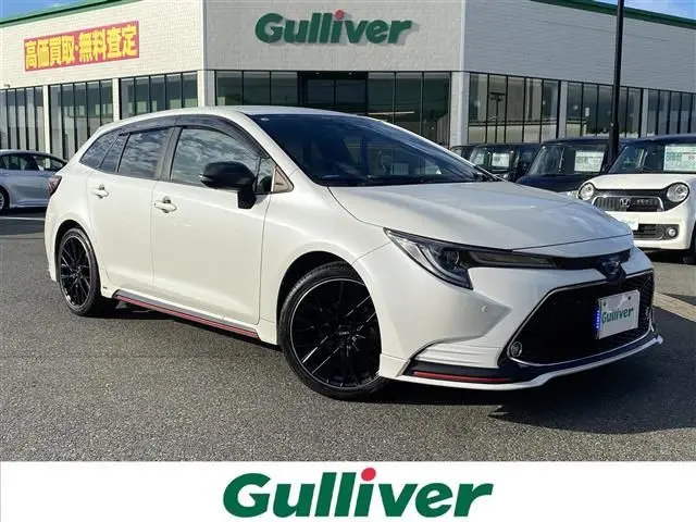 2021 Toyota Corolla Touring Hybrid Double WxB 4WD - photo 1 2021 Toyota Corolla Touring Hybrid Double WxB 4WD Pearl Van for sale, Japanese used car export - photo 1 of 24 | GULJI TRADERS