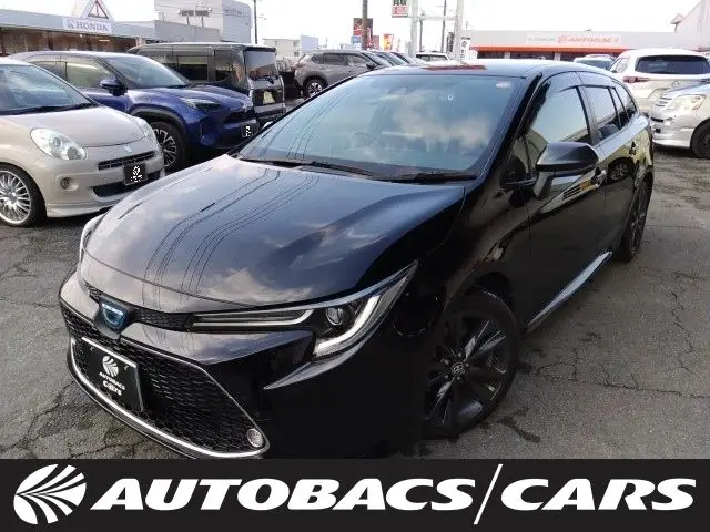 2021 Toyota Corolla Touring 1800 HYBRID W×B 5-door FCVT 2WD 5-seater - photo 1 2021 Toyota Corolla Touring 1800 HYBRID W×B 5-door FCVT 2WD 5-seater Black Van for sale, Japanese used car export - photo 1 of 22 | GULJI TRADERS