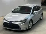 2021 Toyota Corolla Touring Hybrid S Silver Van for sale, Japanese used car export - photo 1 of 3 | GULJI TRADERS