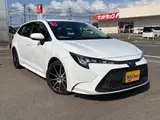 2021 Toyota Corolla Touring 4WD HYBRID G-X White Van for sale, Japanese used car export - photo 1 of 24 | GULJI TRADERS