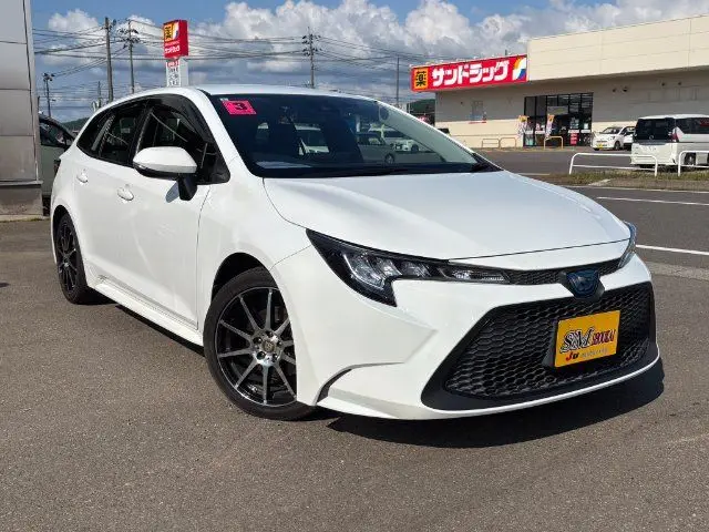 2021 Toyota Corolla Touring 4WD HYBRID G-X - photo 1 2021 Toyota Corolla Touring 4WD HYBRID G-X White Van for sale, Japanese used car export - photo 1 of 24 | GULJI TRADERS