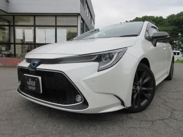 2021 Toyota Corolla Touring HYBRID WXB - photo 1 2021 Toyota Corolla Touring HYBRID WXB Pearl Van for sale, Japanese used car export - photo 1 of 24 | GULJI TRADERS