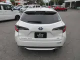 2021 Toyota Corolla Touring HYBRID WXB Pearl Van for sale, Japanese used car export - photo 2 of 24 | GULJI TRADERS