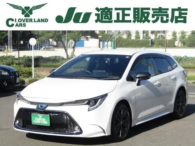 2021 Toyota Corolla Touring 1.8 Hybrid WxB - photo 1 2021 Toyota Corolla Touring 1.8 Hybrid WxB Pearl Van for sale, Japanese used car export - photo 1 of 19 | GULJI TRADERS