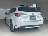 2021 Toyota Corolla Touring 4WD HYBRID WXB White Van for sale, Japanese used car export - photo 2 of 24 | GULJI TRADERS