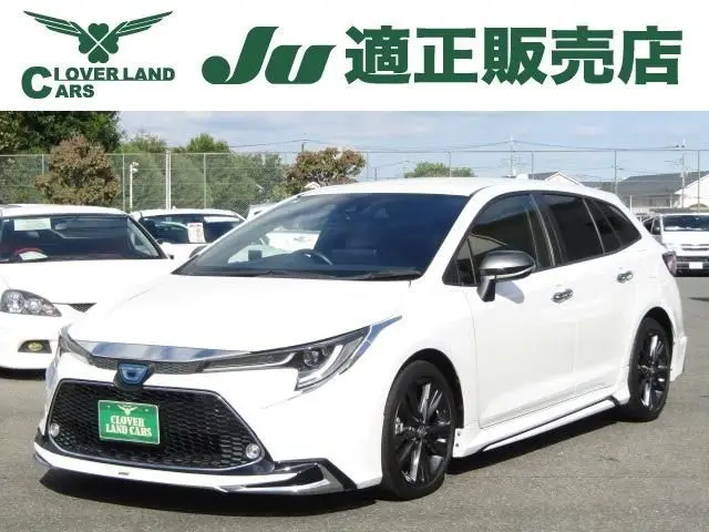 2021 Toyota Corolla Touring 1.8 Hybrid WxB - photo 1 2021 Toyota Corolla Touring 1.8 Hybrid WxB White Van for sale, Japanese used car export - photo 1 of 17 | GULJI TRADERS