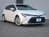 2021 Toyota Corolla Touring Hybrid S Safety Sense Pearl Van for sale, Japanese used car export - photo 1 of 9 | GULJI TRADERS