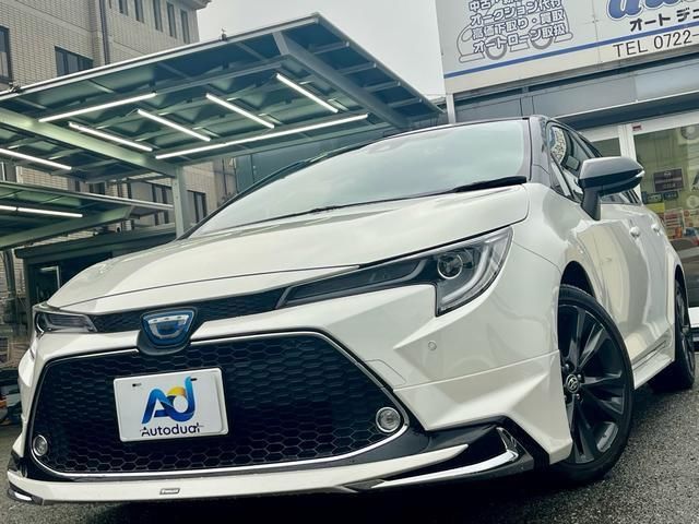 2021 Toyota Corolla Touring Hybrid - photo 1 2021 Toyota Corolla Touring Hybrid Van for sale, Japanese used car export - photo 1 of 9 | GULJI TRADERS