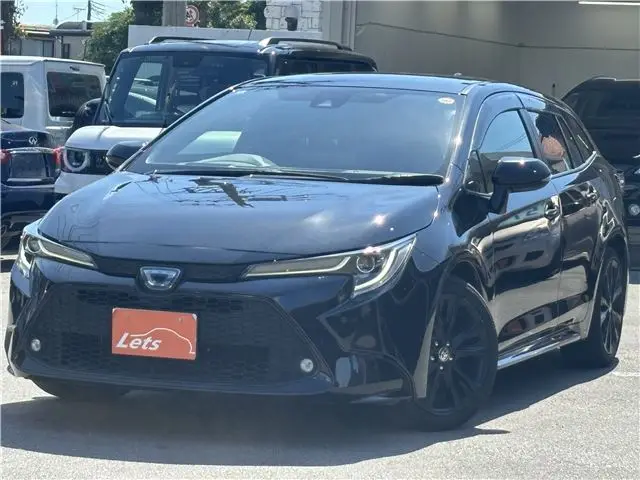 2022 Toyota Corolla Touring Hybrid Double By B 50 Million Edition - photo 1 2022 Toyota Corolla Touring Hybrid Double By B 50 Million Edition Black Van for sale, Japanese used car export - photo 1 of 80 | GULJI TRADERS