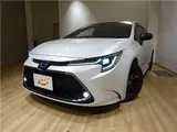 2022 Toyota Corolla Touring Hybrid W×B 4WD Pearl Van for sale, Japanese used car export - photo 1 of 42 | GULJI TRADERS