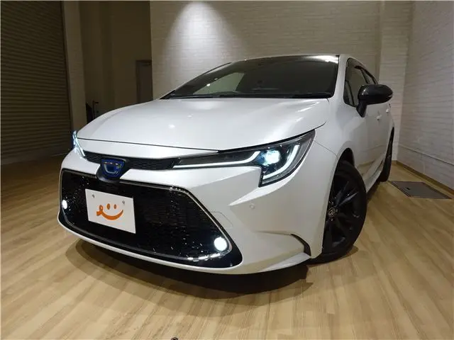 2022 Toyota Corolla Touring Hybrid W×B 4WD - photo 1 2022 Toyota Corolla Touring Hybrid W×B 4WD Pearl Van for sale, Japanese used car export - photo 1 of 42 | GULJI TRADERS