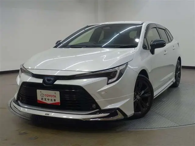 2022 Toyota Corolla Touring 1.8 Hybrid WxB - photo 1 2022 Toyota Corolla Touring 1.8 Hybrid WxB White Van for sale, Japanese used car export - photo 1 of 32 | GULJI TRADERS