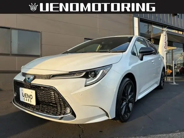 2022 Toyota Corolla Touring 1.8 Hybrid WxB - photo 1 2022 Toyota Corolla Touring 1.8 Hybrid WxB White Van for sale, Japanese used car export - photo 1 of 25 | GULJI TRADERS