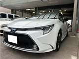 2022 Toyota Corolla Touring Hybrid WxB Pearl Van for sale, Japanese used car export - photo 1 of 44 | GULJI TRADERS