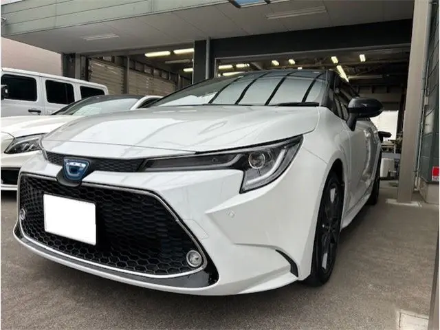 2022 Toyota Corolla Touring Hybrid WxB Pearl Van for sale, Japanese used car export - photo 1 of 44 | GULJI TRADERS