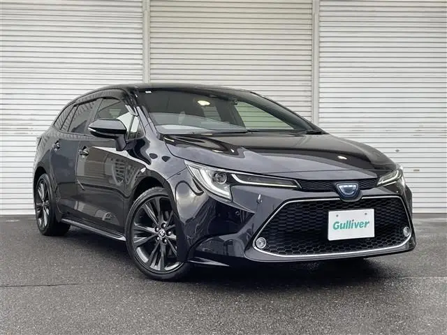 2022 Toyota Corolla Touring Hybrid Double WxB 4WD - photo 1 2022 Toyota Corolla Touring Hybrid Double WxB 4WD Black Van for sale, Japanese used car export - photo 1 of 24 | GULJI TRADERS