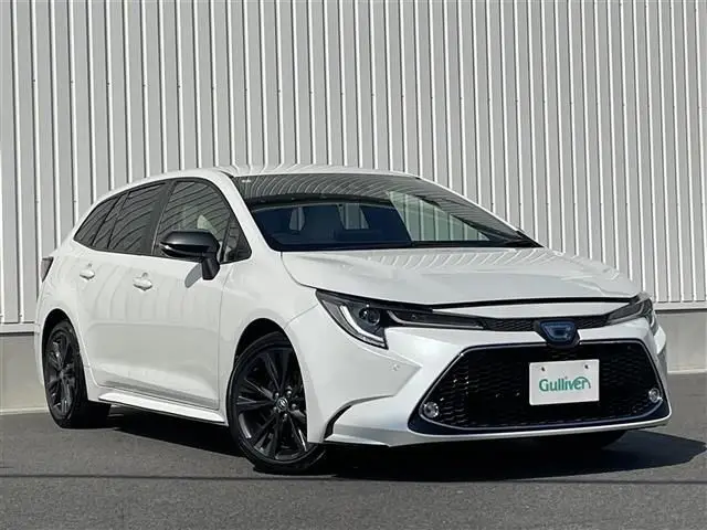2022 Toyota Corolla Touring Hybrid Double By - photo 1 2022 Toyota Corolla Touring Hybrid Double By White Van for sale, Japanese used car export - photo 1 of 24 | GULJI TRADERS