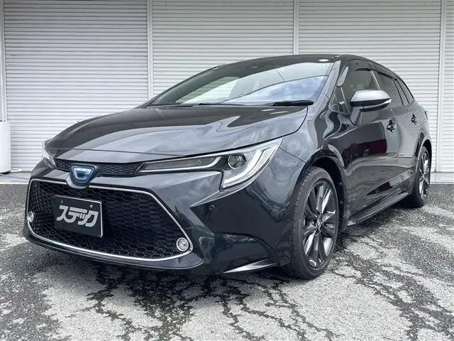 2022 Toyota Corolla Touring 1.8 HYBRID WxB - photo 1 2022 Toyota Corolla Touring 1.8 HYBRID WxB Black Van for sale, Japanese used car export - photo 1 of 20 | GULJI TRADERS