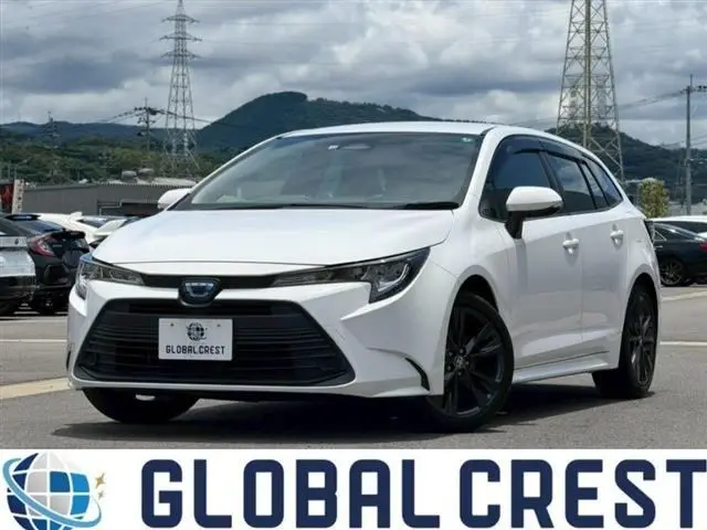 2022 Toyota Corolla Touring 1.8HV x pure 17AW - photo 1 2022 Toyota Corolla Touring 1.8HV x pure 17AW White Van for sale, Japanese used car export - photo 1 of 30 | GULJI TRADERS