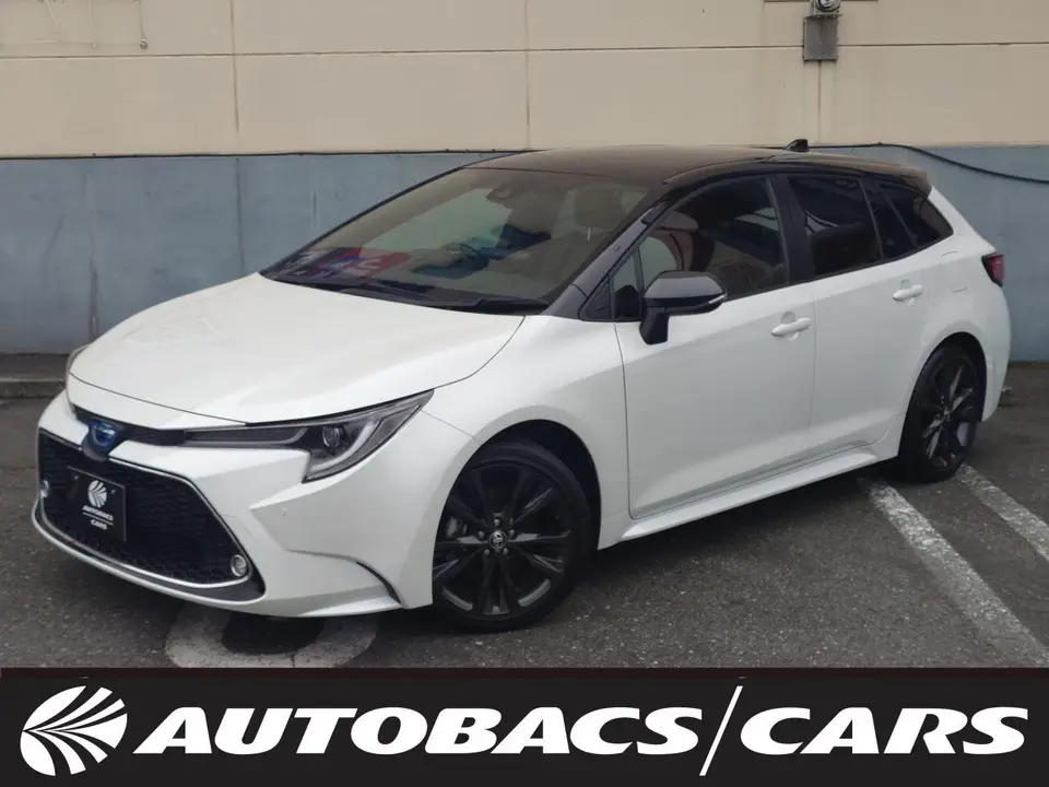 2022 Toyota Corolla Touring HYBRIDW×B 2WD - photo 1 2022 Toyota Corolla Touring HYBRIDW×B 2WD White Van for sale, Japanese used car export - photo 1 of 24 | GULJI TRADERS