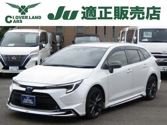 2022 Toyota Corolla Touring 1.8 Hybrid WxB - photo 1 2022 Toyota Corolla Touring 1.8 Hybrid WxB White Van for sale, Japanese used car export - photo 1 of 19 | GULJI TRADERS