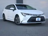 2022 Toyota Corolla Touring Hybrid G ​​Safety Sense Pearl Van for sale, Japanese used car export - photo 1 of 9 | GULJI TRADERS