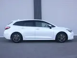 2022 Toyota Corolla Touring Hybrid G ​​Safety Sense Pearl Van for sale, Japanese used car export - photo 4 of 9 | GULJI TRADERS