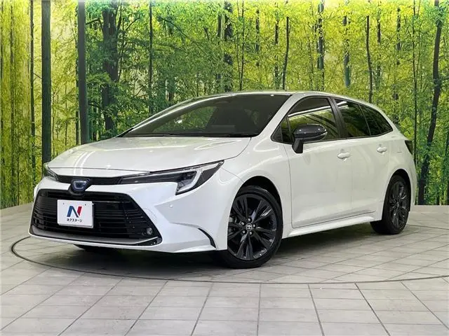 2023 Toyota Corolla Touring Hybrid Double B - photo 1 2023 Toyota Corolla Touring Hybrid Double B Pearl Van for sale, Japanese used car export - photo 1 of 30 | GULJI TRADERS
