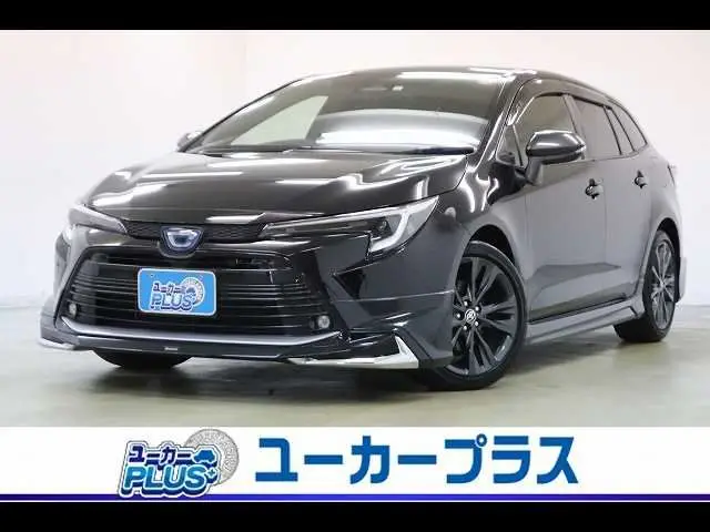 2023 Toyota Corolla Touring HYBRID W×B Modellista Aero 10.5-inch DA Navi - photo 1 2023 Toyota Corolla Touring HYBRID W×B Modellista Aero 10.5-inch DA Navi Black Van for sale, Japanese used car export - photo 1 of 37 | GULJI TRADERS