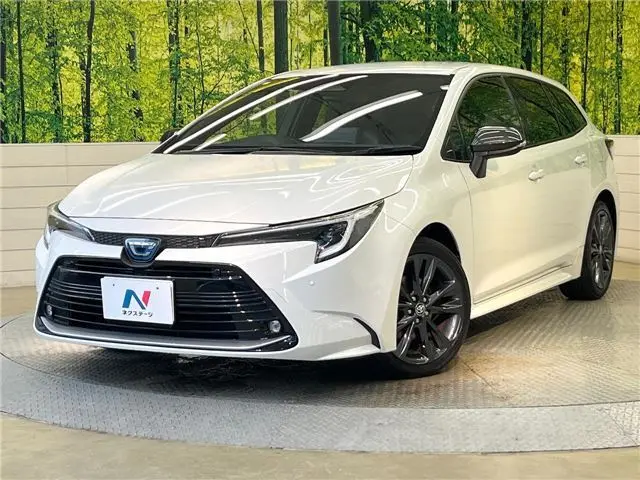 2023 Toyota Corolla Touring Hybrid Double By - photo 1 2023 Toyota Corolla Touring Hybrid Double By Pearl Van for sale, Japanese used car export - photo 1 of 30 | GULJI TRADERS