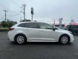 2023 Toyota Corolla Touring 1.8 Hybrid G ​​E-Four 4WD White Van for sale, Japanese used car export - photo 24 of 48 | GULJI TRADERS