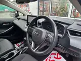2023 Toyota Corolla Touring 1.8 Hybrid G ​​E-Four 4WD White Van for sale, Japanese used car export - photo 28 of 48 | GULJI TRADERS