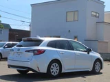 2023 Toyota Corolla Touring 1.8 Hybrid G E-Four 4WD Van for sale, Japanese used car export - photo 2 of 23 | GULJI TRADERS