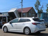 2023 Toyota Corolla Touring 1.8 Hybrid G E-Four 4WD Van for sale, Japanese used car export - photo 4 of 23 | GULJI TRADERS