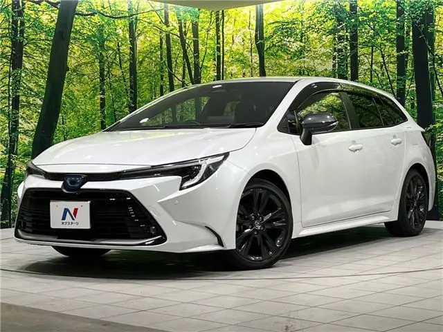 2023 Toyota Corolla Touring Hybrid Double By - photo 1 2023 Toyota Corolla Touring Hybrid Double By Pearl Van for sale, Japanese used car export - photo 1 of 30 | GULJI TRADERS