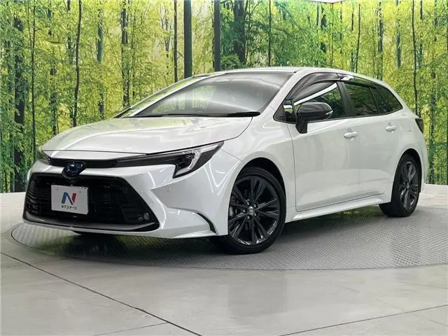 2023 Toyota Corolla Touring Hybrid Double By - photo 1 2023 Toyota Corolla Touring Hybrid Double By Pearl Van for sale, Japanese used car export - photo 1 of 30 | GULJI TRADERS