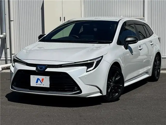 2023 Toyota Corolla Touring Hybrid Double By - photo 1 2023 Toyota Corolla Touring Hybrid Double By Pearl Van for sale, Japanese used car export - photo 1 of 30 | GULJI TRADERS