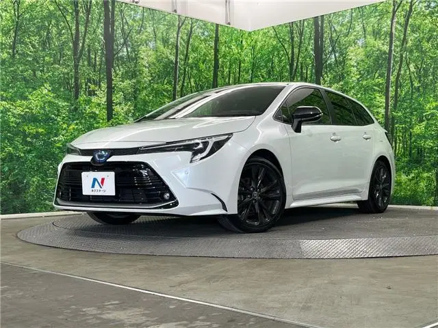 2023 Toyota Corolla Touring Hybrid Double By - photo 1 2023 Toyota Corolla Touring Hybrid Double By Pearl Van for sale, Japanese used car export - photo 1 of 30 | GULJI TRADERS