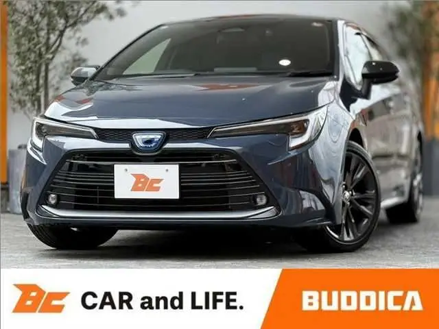 2023 Toyota Corolla Touring Hybrid Double B-B ★Late Model★HUD★BSM★DA - photo 1 2023 Toyota Corolla Touring Hybrid Double B-B ★Late Model★HUD★BSM★DA Gray Van for sale, Japanese used car export - photo 1 of 50 | GULJI TRADERS