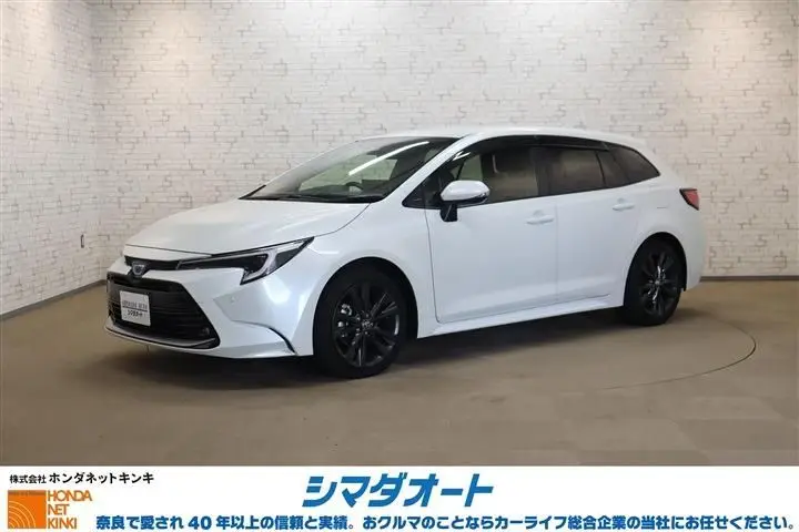 2023 Toyota Corolla Touring HYBRID WxB - photo 1 2023 Toyota Corolla Touring HYBRID WxB Pearl Van for sale, Japanese used car export - photo 1 of 30 | GULJI TRADERS
