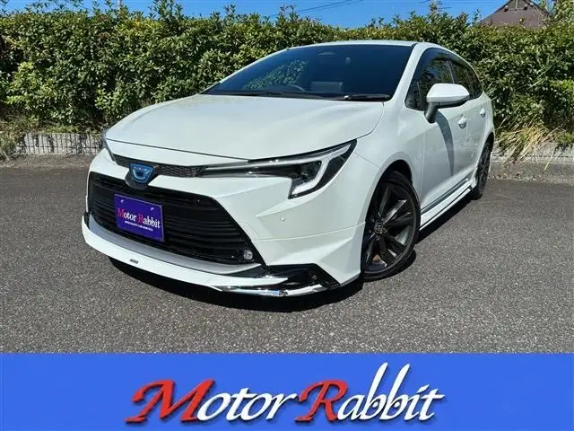 2023 Toyota Corolla Touring 1.8 HYBRID WxB - photo 1 2023 Toyota Corolla Touring 1.8 HYBRID WxB Pearl Van for sale, Japanese used car export - photo 1 of 23 | GULJI TRADERS