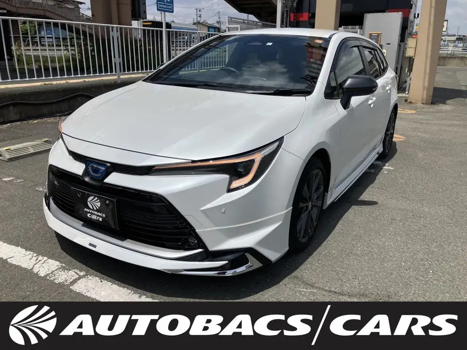 2023 Toyota Corolla Touring W×B (Hybrid Vehicle) 4WD - photo 1 2023 Toyota Corolla Touring W×B (Hybrid Vehicle) 4WD Pearl Van for sale, Japanese used car export - photo 1 of 24 | GULJI TRADERS