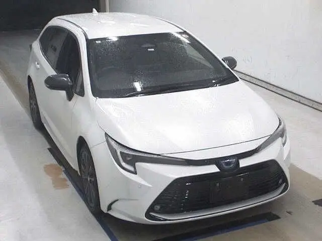 2023 Toyota Corolla Touring HYBRID WXB - photo 1 2023 Toyota Corolla Touring HYBRID WXB Pearl Van for sale, Japanese used car export - photo 1 of 7 | GULJI TRADERS
