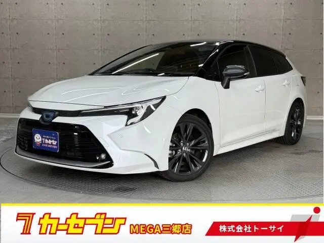 2023 Toyota Corolla Touring 1.8 Hybrid WxB E-Four 4WD - photo 1 2023 Toyota Corolla Touring 1.8 Hybrid WxB E-Four 4WD Pearl Van for sale, Japanese used car export - photo 1 of 20 | GULJI TRADERS